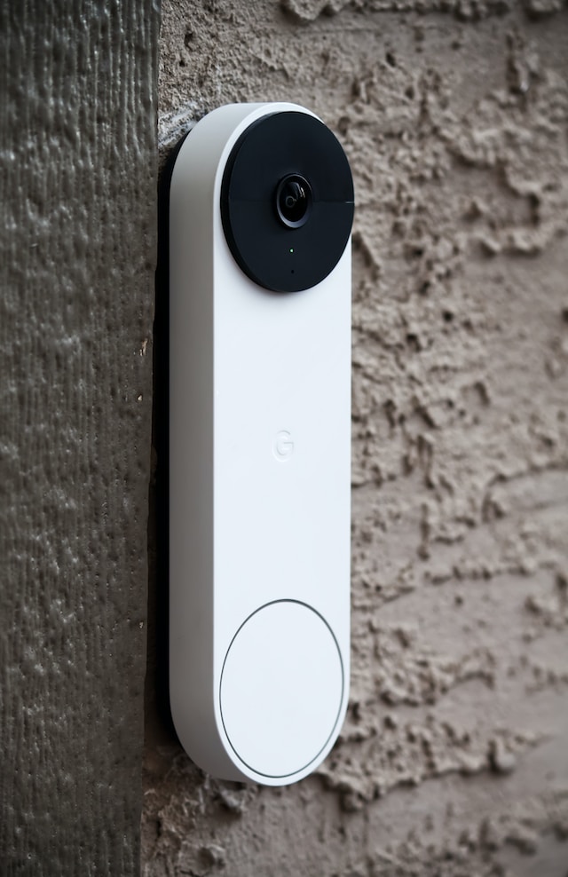Smart Door Bell / Camera hanging on the side of a wall