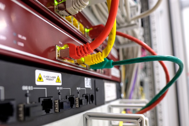close up of network rack, several devices connected via networking cables.