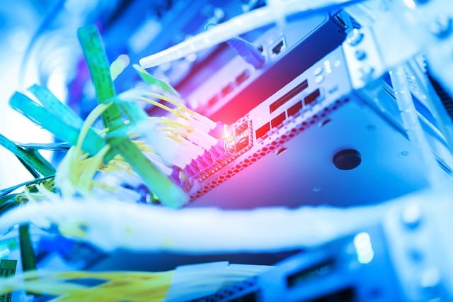 Close up of a server rack, looking from the right up. Lot's of lights and pretty colors.